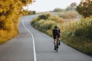 Male cyclist on road